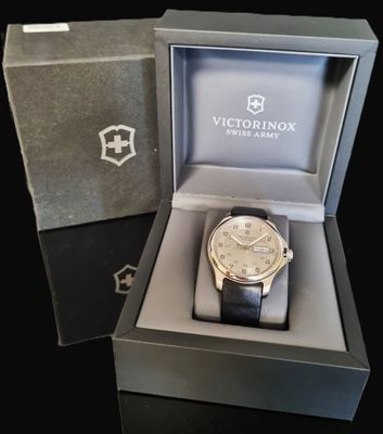 a watch that is in a box on a table