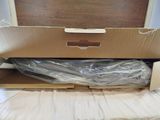 a cardboard box that is open on a bed