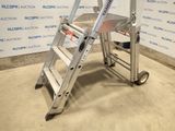 a ladder that is sitting in front of a wall