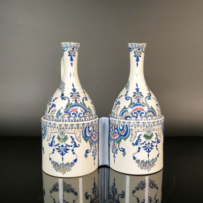 two vases that are sitting on a table