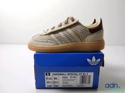 the adidas superstar is on top of a blue box