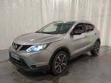 the silver nissan qx sport is parked in a garage