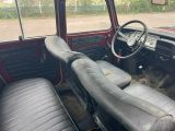 an old car with leather seats and a steering wheel
