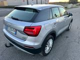 the rear end of a silver volkswagen suv parked in a parking lot