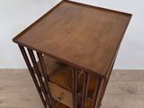 an image of a wooden table with three drawers on top of it