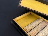 a box with a set of matches in it on a table