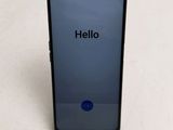 a close up of the back of a phone with a hello button on it