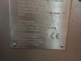 a metal plaque on the side of a machine