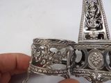 a person holding a silver object in their hand