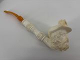 une pipe sur laquelle est sculpté le visage d'un homme
