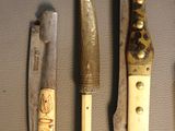 five different types of knives on display on a table
