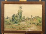 painting on easel of a landscape with a river and trees
