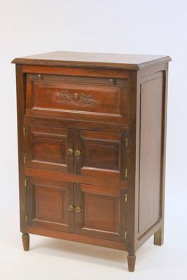 a small wooden chest of drawers on a white background