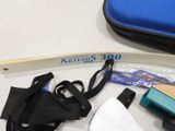 a bag of items sitting on a table next to a pair of scissors and a pair of scissors