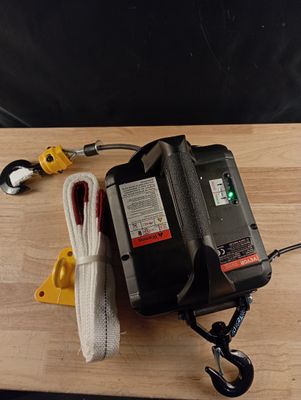 a picture of a cord and a battery on a wooden table
