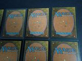 a close up of a set of six cards on a table