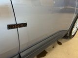 a close up of a car door with a sticker on it