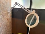 a mirror and a banana on a stand in a bathroom