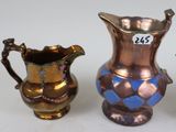 three different types of vases on a white surface with a price tag