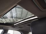 a view of the sunroof from inside of a car