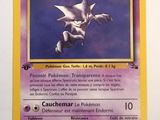 a close up of a pokemon card on a white surface