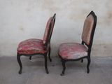 pair of antique chairs with upholstered upholstered back cushions