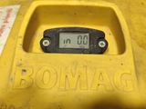 a close up of a digital clock in a yellow container