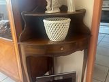 a small table with a bowl on top of it