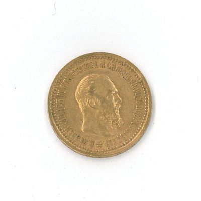 une pièce d'or sur laquelle figure le visage d'un homme