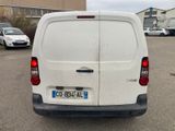 a white van that is parked in a parking lot