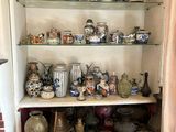 many vases on the shelves in the corner of the room