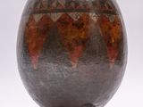 an image of a decorative vase on a wooden stand