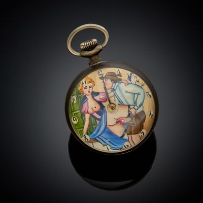 a pocket watch with a picture of a man and a woman on it