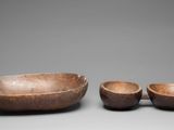 two wooden bowls and a bowl on a table