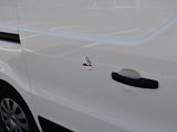 a white van that is parked in a parking lot