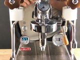a coffee machine that is sitting on a wooden table