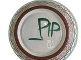 a picture of a ceramic plate with the word pap written on it
