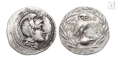a close up of a coin with an owl on it