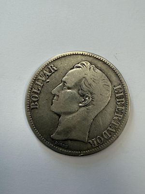 the coin is sitting on a white surface with a white background