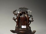 an image of a wooden statue of a man with a hat on his head