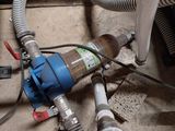 a hose and a water pump on the floor