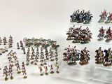 a lot of figurines that are sitting on a table