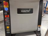 a machine that is sitting on the counter in the kitchen