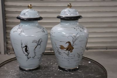 two vases that are sitting on a table