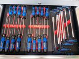 many tools in the drawer of a tool case