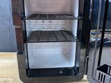 two small refrigerators that are sitting on a table