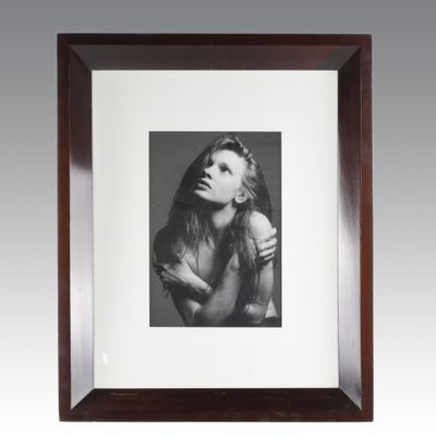 a black and white photo of a woman with long hair