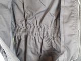 the inside of a jacket with zippers and a zippered pocket
