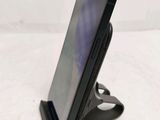 a cell phone that is sitting on a stand