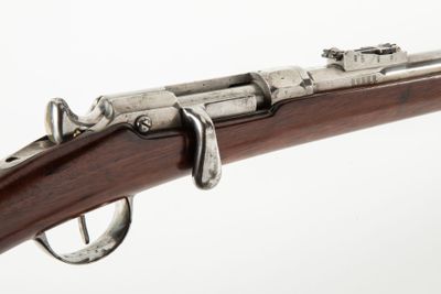 a close up of a rifle on a white background with a white background